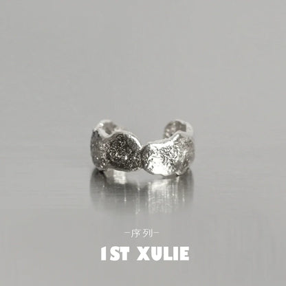 Minimalist frosted ear cuffs in silver with a unique textured design for stylish ear accessories