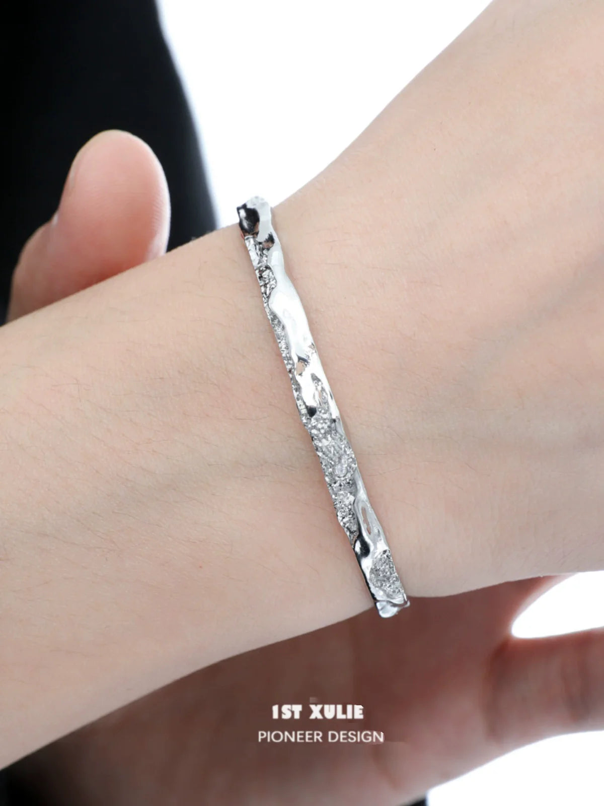 Stylish minimalist silver bracelet by 1STXULIE, featuring a sleek and modern design