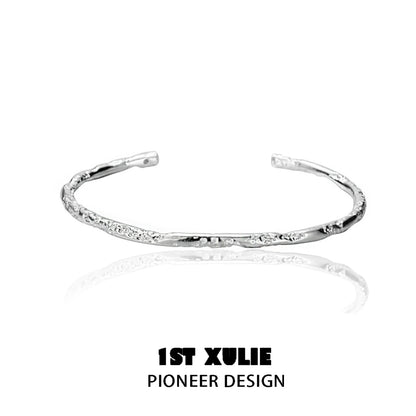 Sleek minimalist silver bracelet by 1STXULIE with a textured design for everyday elegance