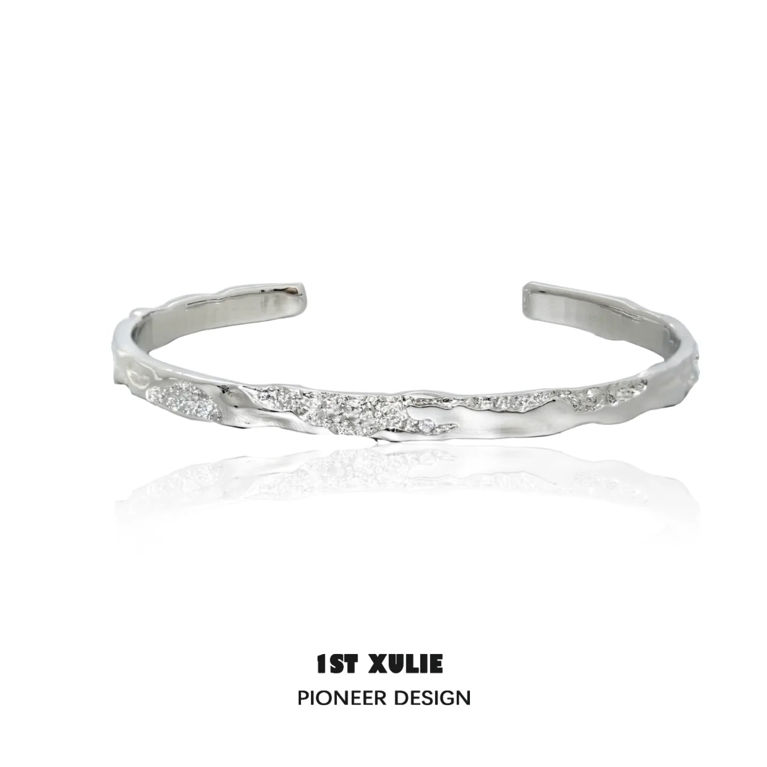 1ST XULIE minimalist silver bracelet with a sleek, modern design and subtle texture