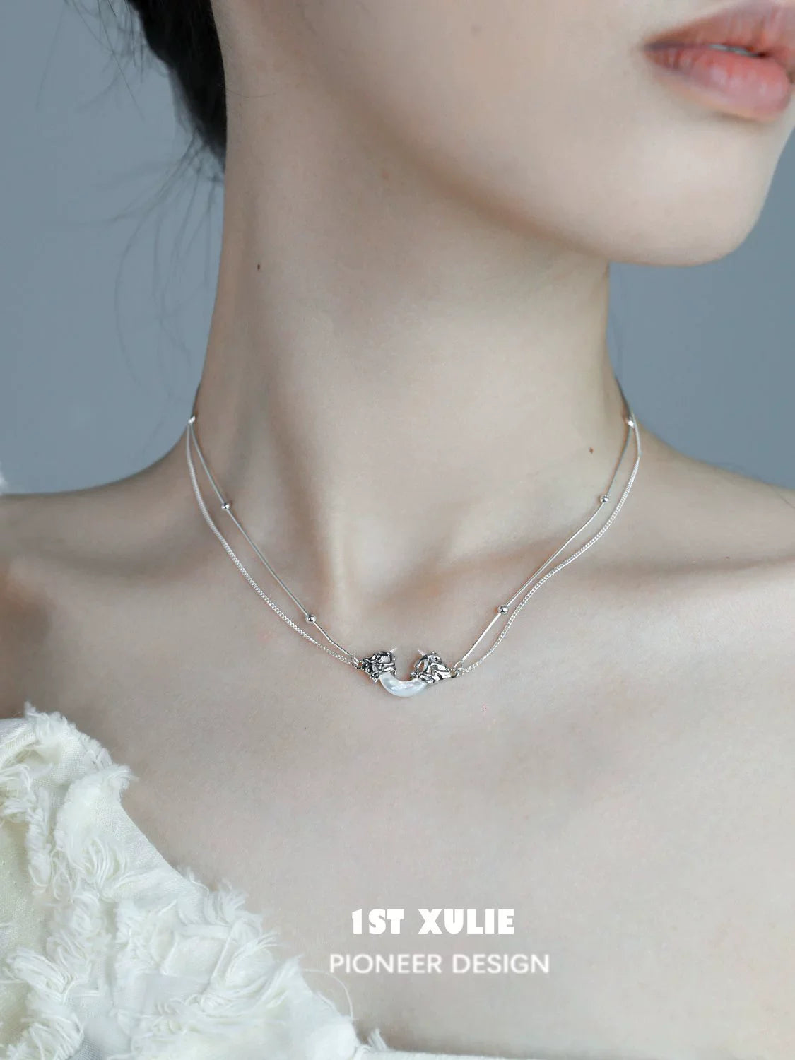 Moonlight couple necklace with elegant design, featuring intertwined silver strands and unique detailing