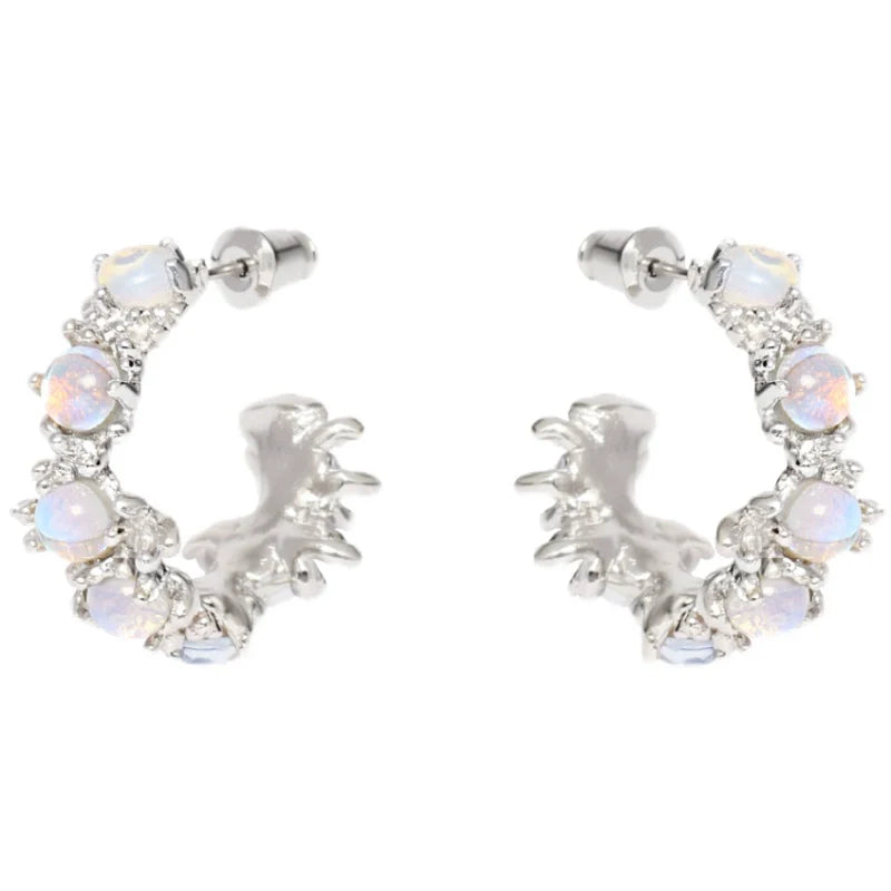 Elegant silver moonstone hoop earrings adorned with shimmering stones for a stylish look