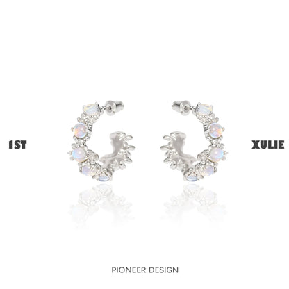 Elegant silver moonstone hoop earrings adorned with sparkling stones for a chic look