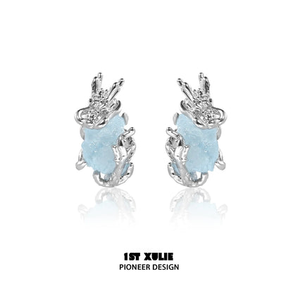 Mystic elf earrings featuring silver design and blue stone for a magical touch