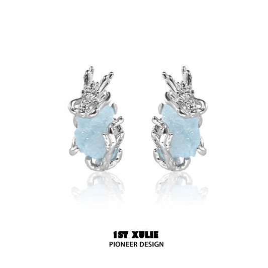 Mystic elf earrings featuring silver design and blue stone for a magical touch