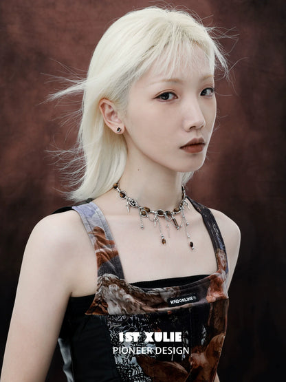 Model wearing 1STXULIE mystic eye earrings, showcasing a chic and modern design against a dark backdrop.