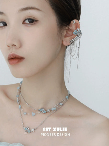 Mystic mermaid tail earrings with intricate detailing, perfect for ocean-inspired jewelry lovers