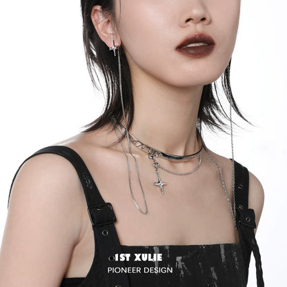 Model wearing a silver mystic star necklace with layered chains and star pendant for a trendy look