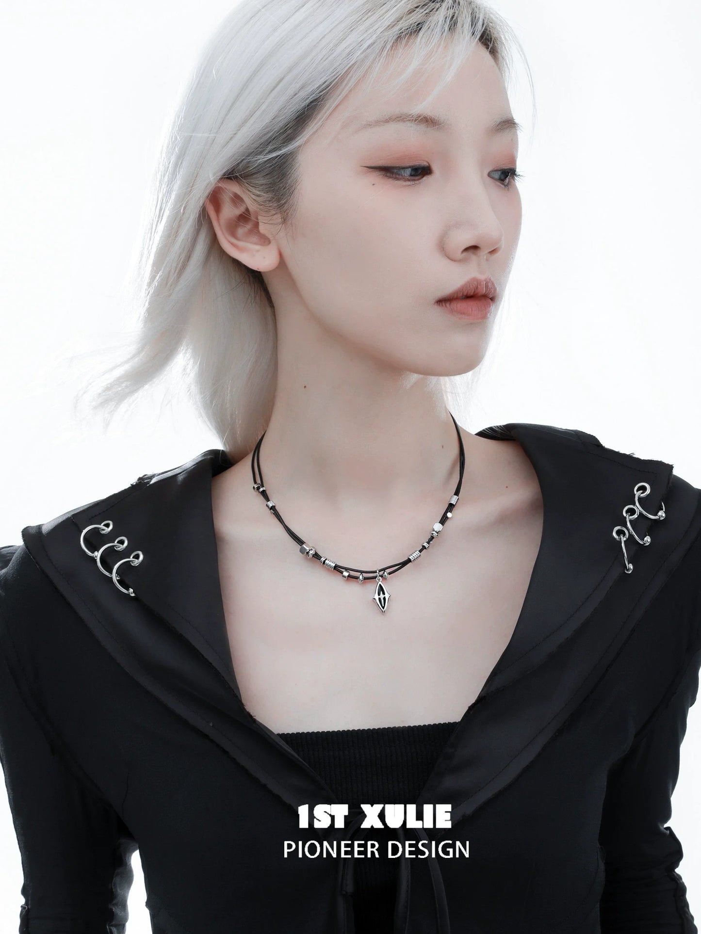 Northern star beaded leather necklace designed by 1STXULIE worn by a model with a stylish look