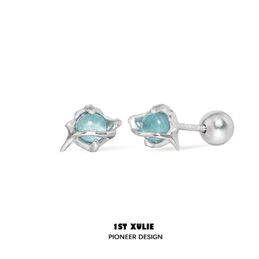 Stylish ocean blue stud earrings with unique floral design and silver accents