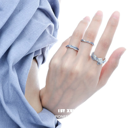 Ocean elf couple ring set in silver with unique textured design on elegant fingers
