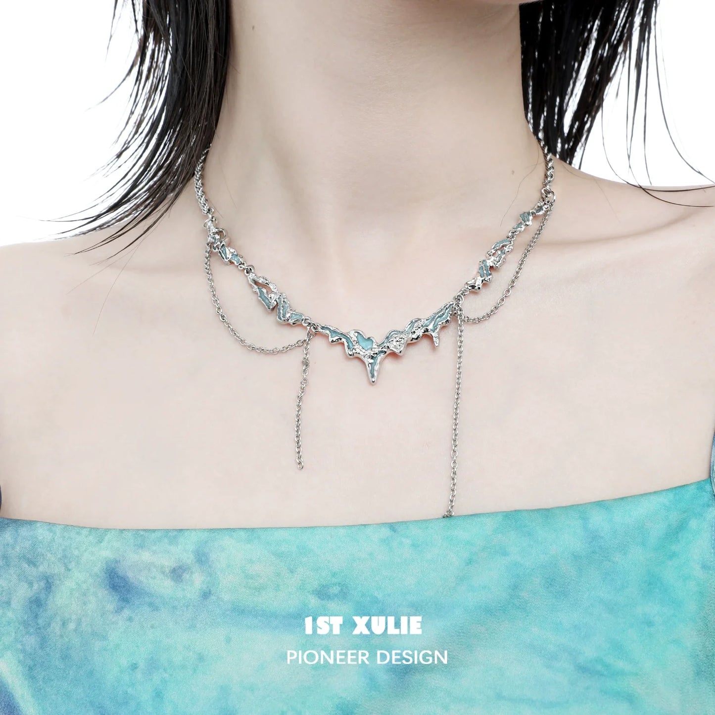 1ST XULIE ocean inspired tassel necklace featuring a unique silver design for a chic look
