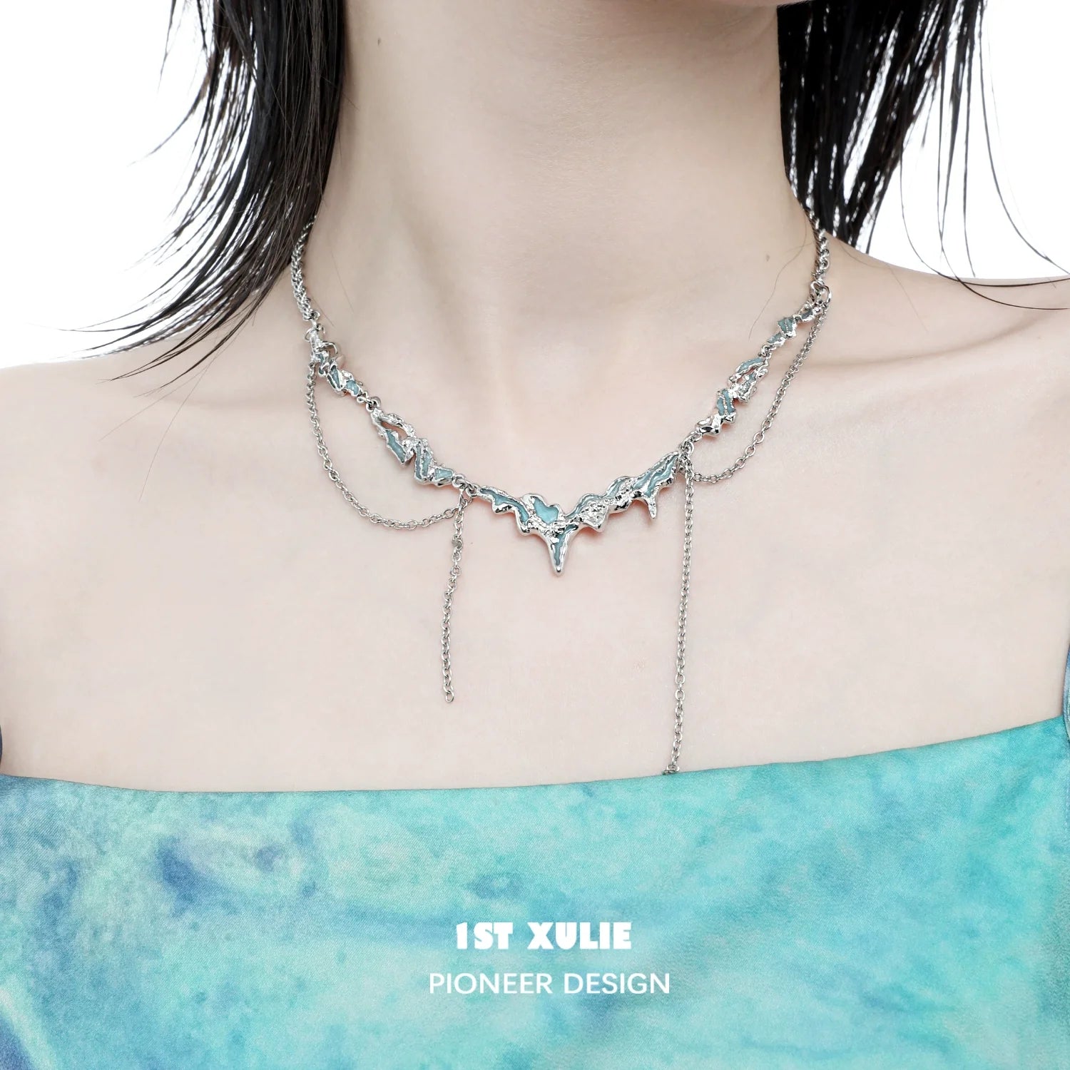 1ST XULIE ocean inspired tassel necklace featuring a unique silver design for a chic look