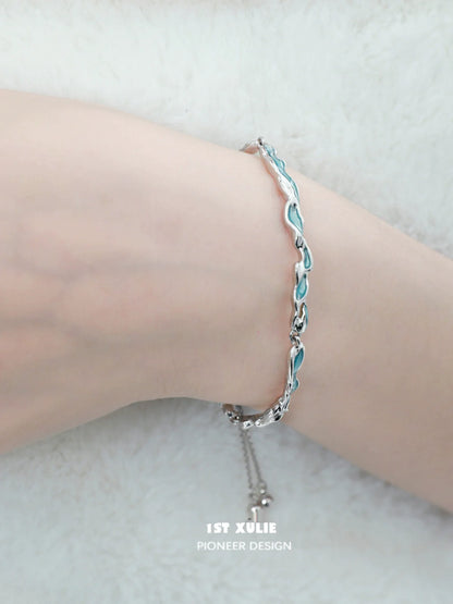 1STXULIE ocean tide blue bracelet with a sleek design on a wrist for stylish accessory lovers