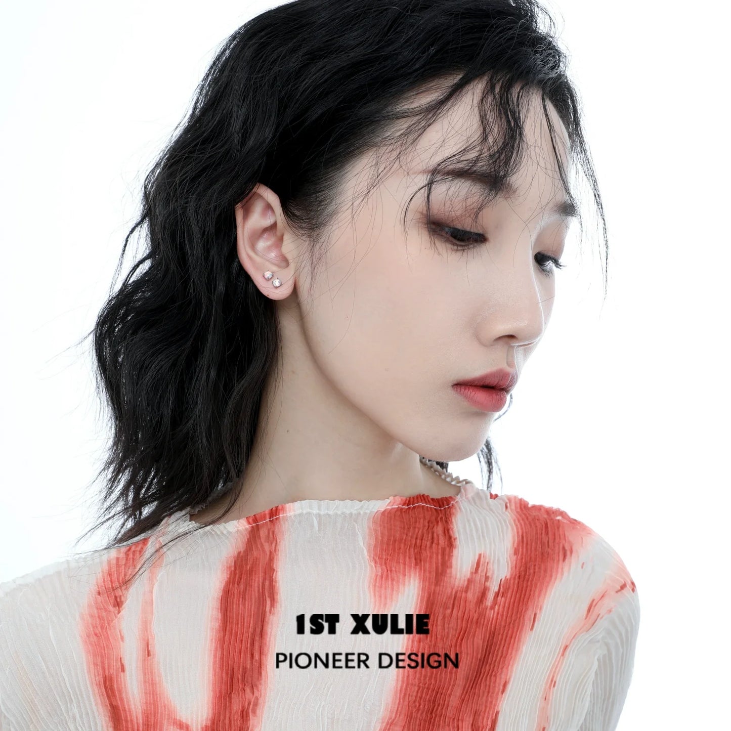 Model wearing elegant 1ST XULIE opal stud earrings that add a touch of sophistication