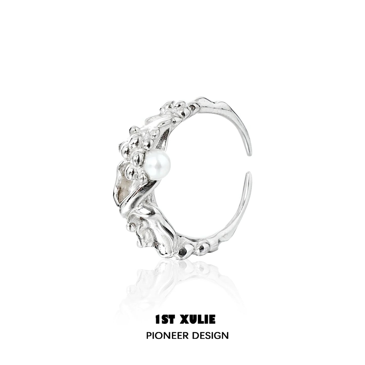 Unique 1STXULIE pearl silver ring featuring intricate detailing and a single pearl accent