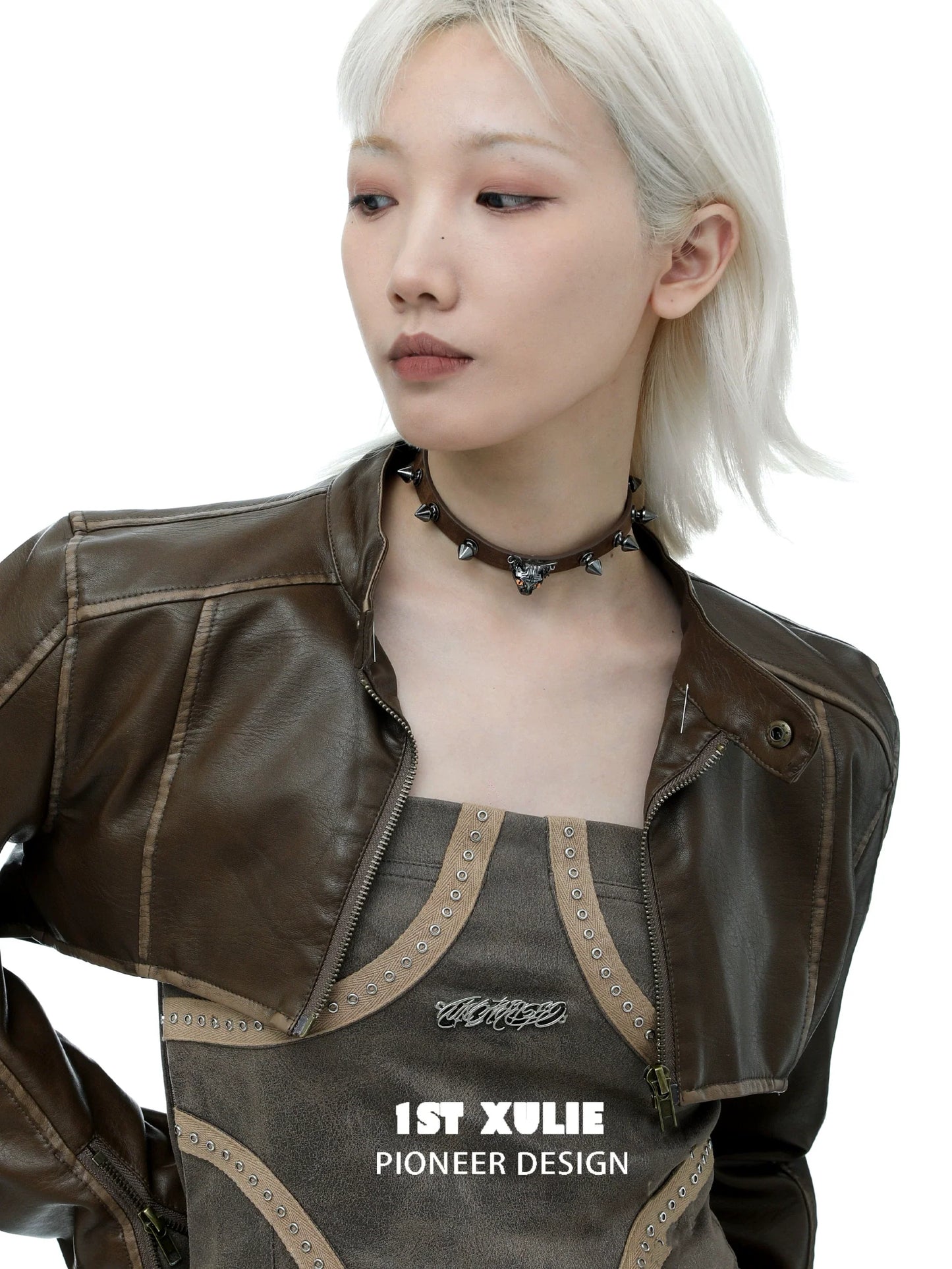 Model wearing a punk cat studded choker with a stylish brown jacket for a trendy look