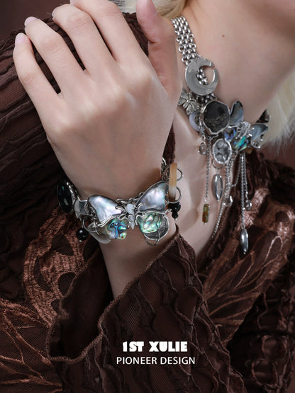 Retro punk butterfly bracelet with unique charms and metallic elements for a bold fashion statement