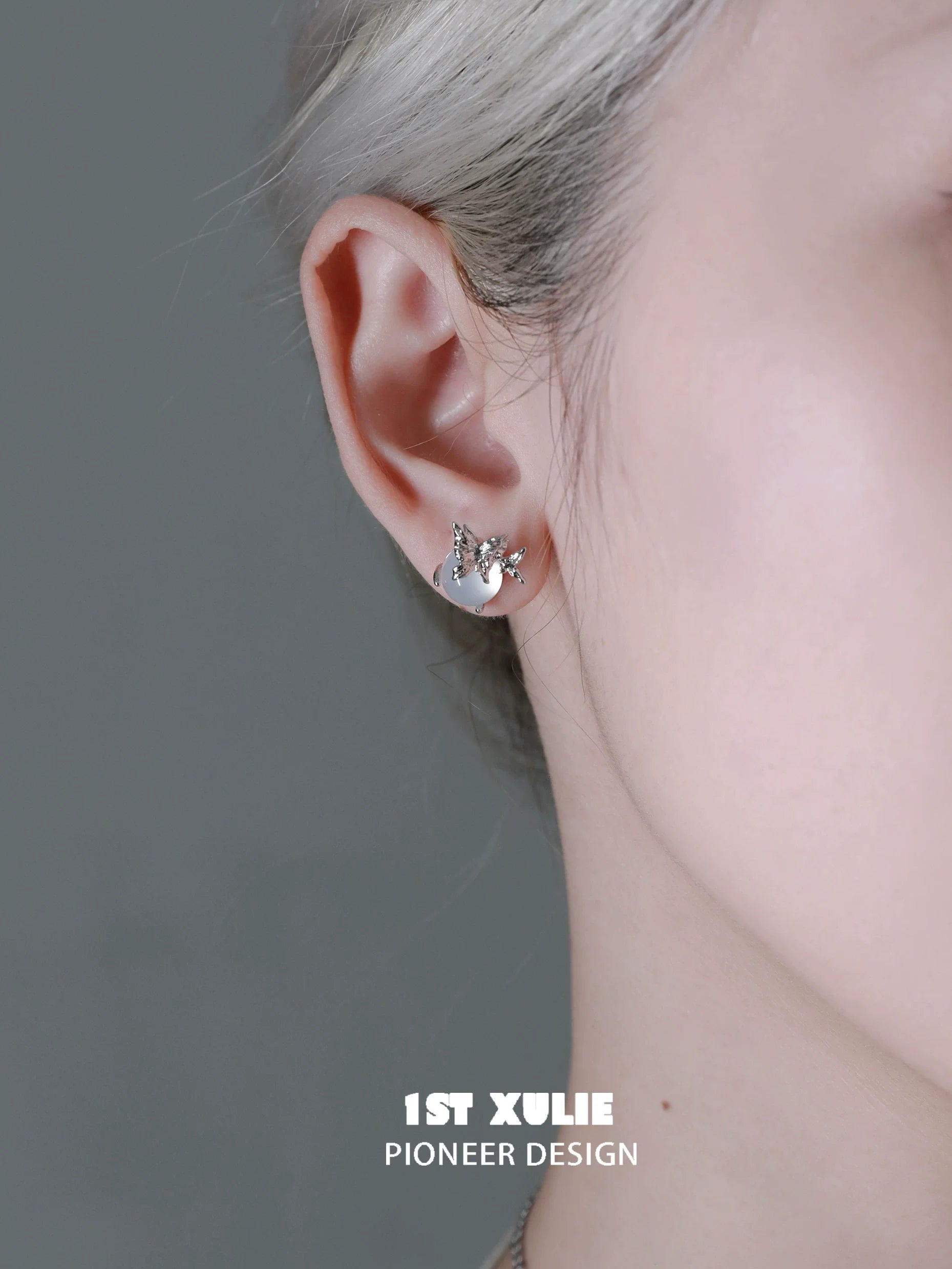 Elegant silver butterfly stud earrings, adding a touch of charm to any outfit