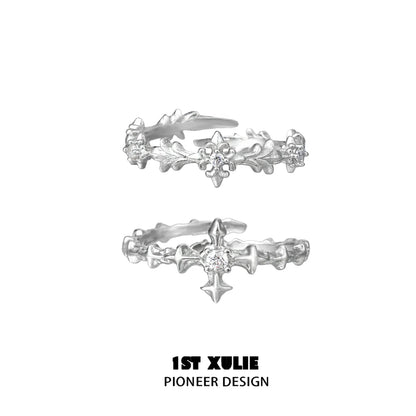 Elegant silver cross couple rings with intricate design and sparkling accents from 1STXULIE