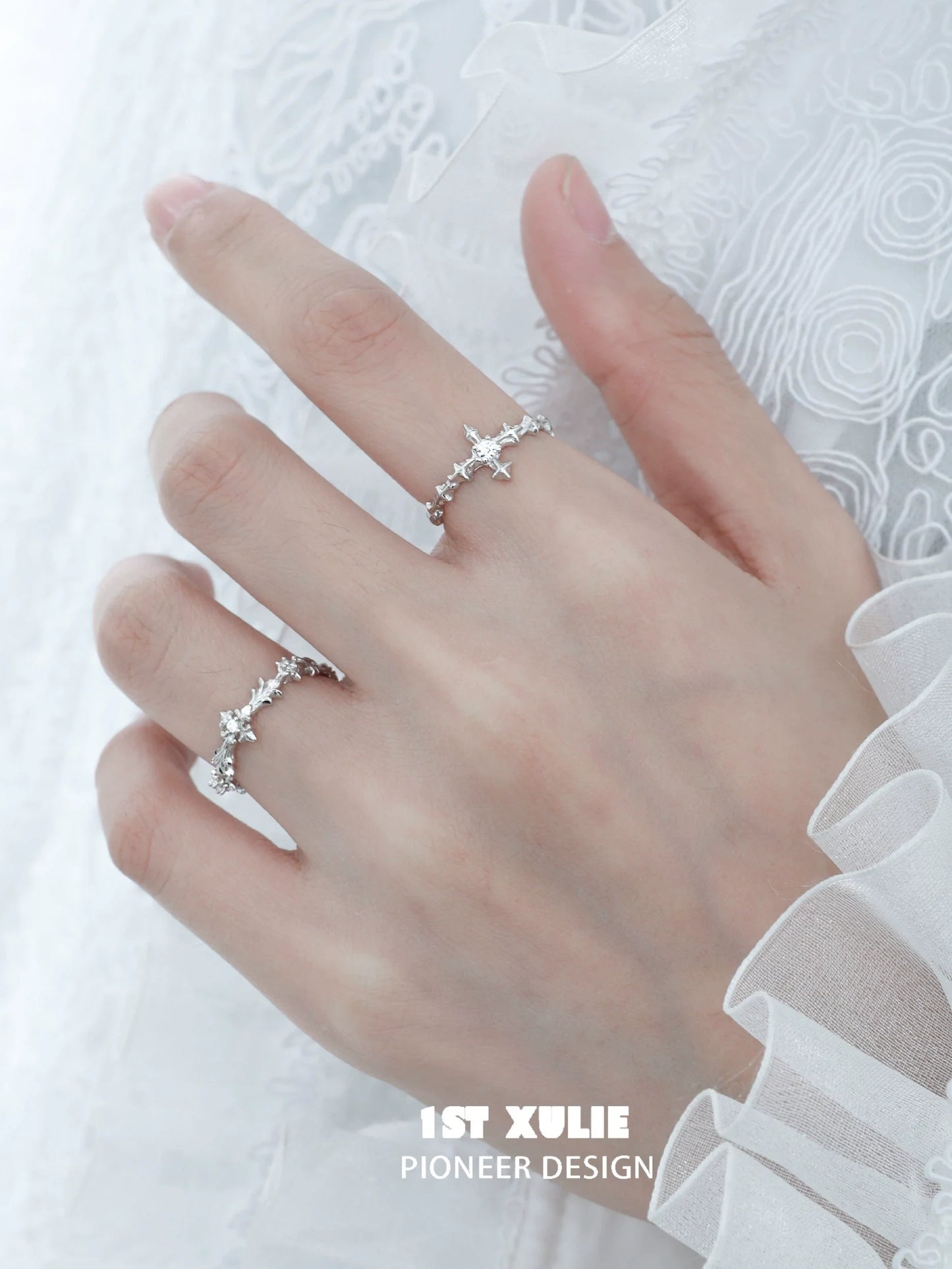 Elegant silver cross couple rings with intricate design and sparkling details for romantic gestures