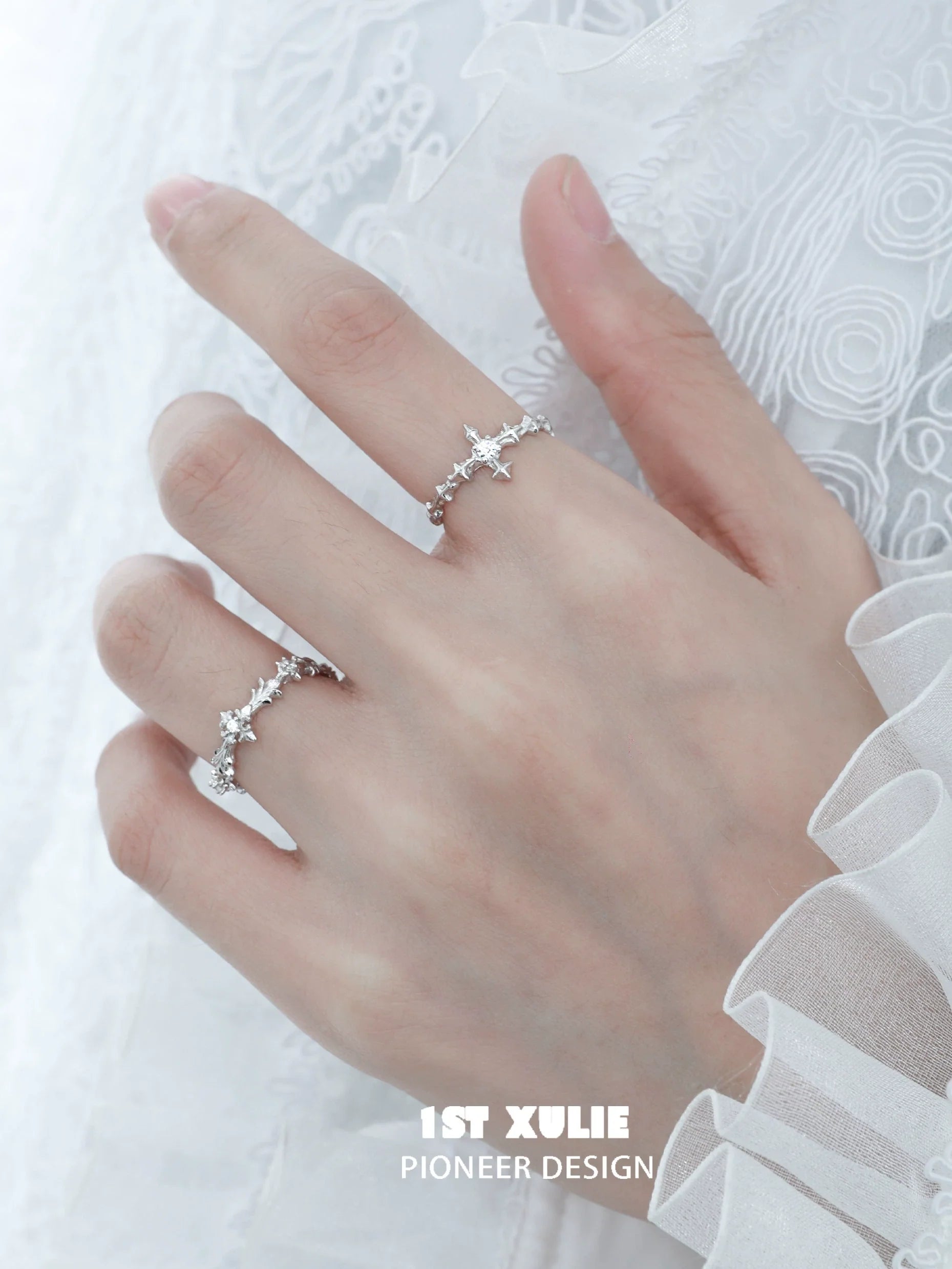 Elegant silver cross couple rings with intricate design and sparkling details for romantic gestures