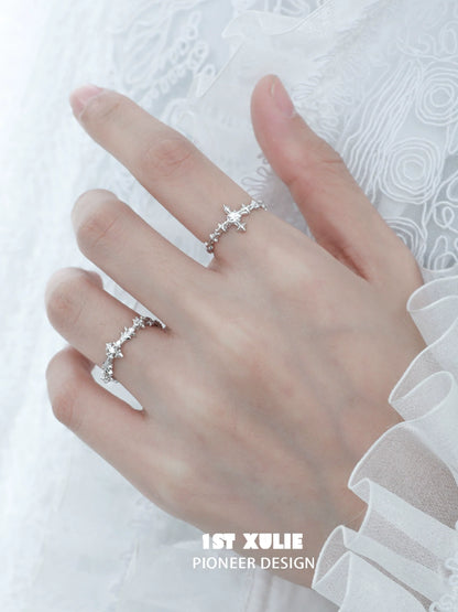 Elegant silver cross couple rings with intricate design and sparkling details for romantic gestures