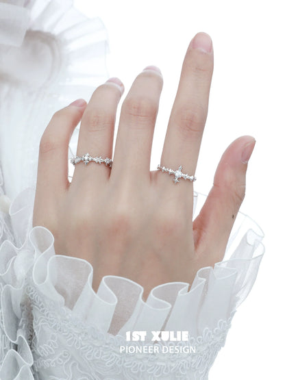 Elegant silver cross couple rings featuring sparkling gemstones for a romantic touch