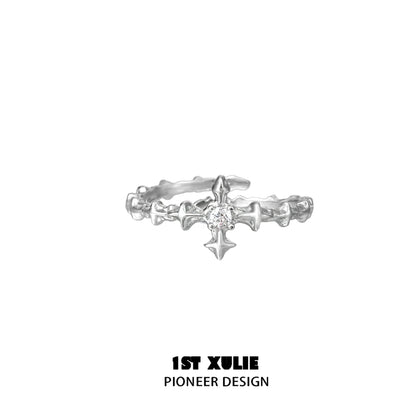 Elegant silver cross couple rings featuring a delicate design and sparkling center stone
