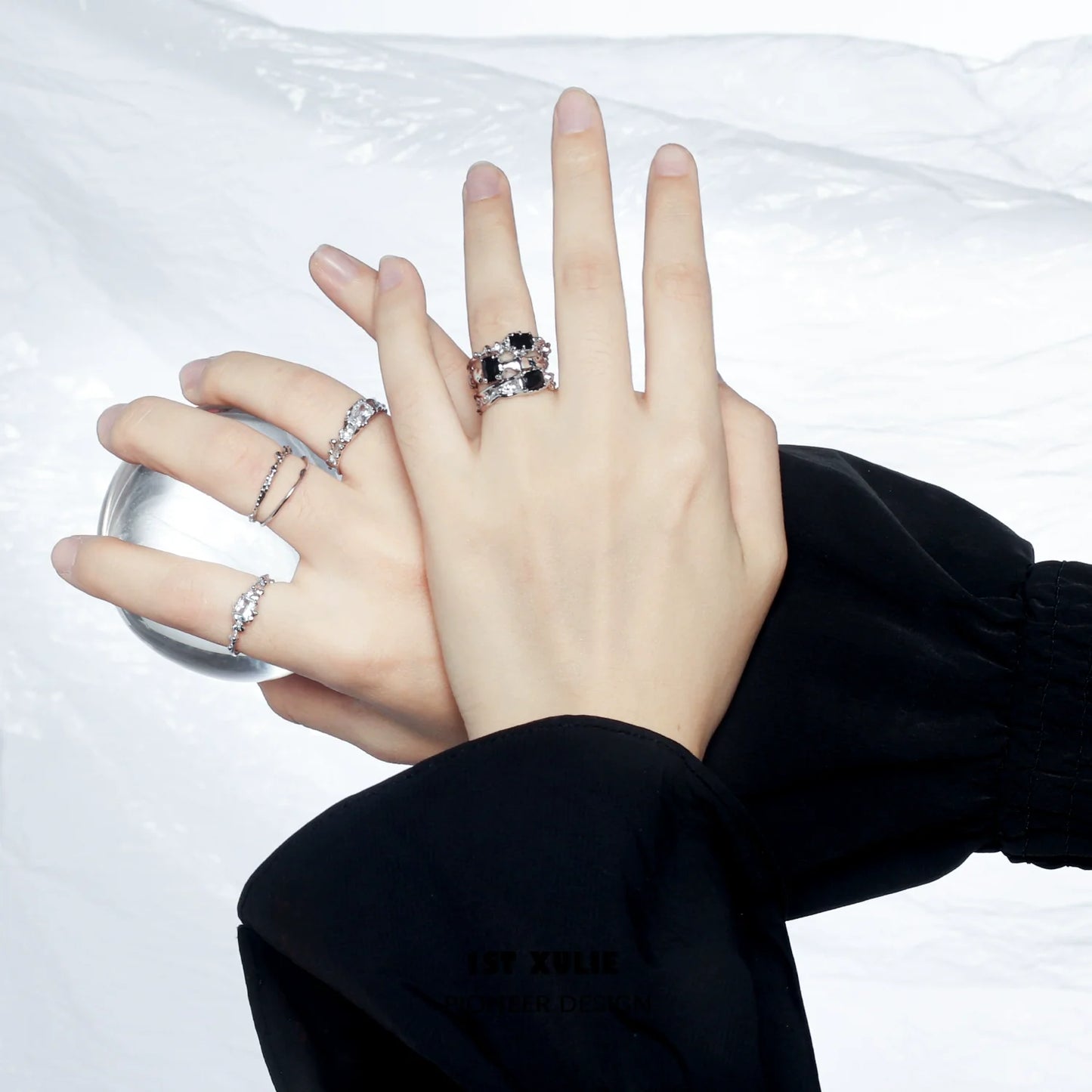Elegant silver crown couple ring showcased on hands with stylish accessories