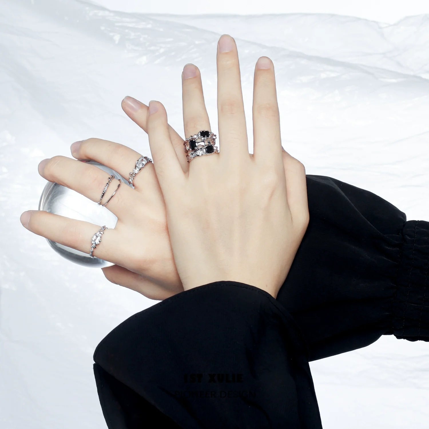Elegant silver crown couple ring showcased on hands with stylish accessories