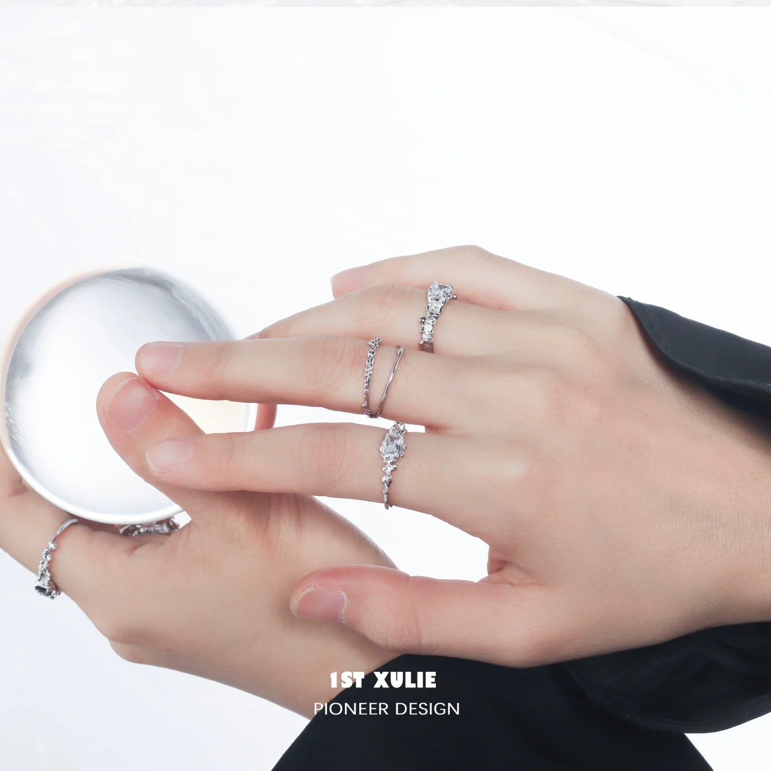 Elegant silver crown couple ring on fingers, showcasing intricate design and shine
