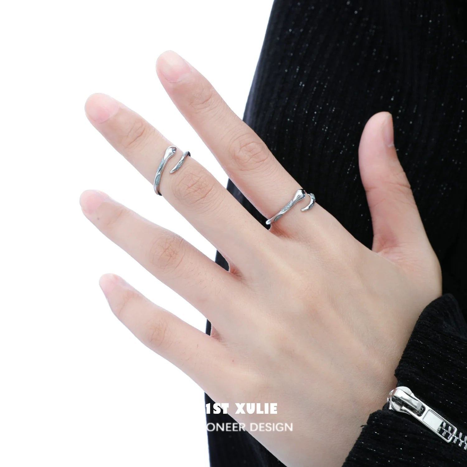 Stylish silver snake ring on hand, perfect for unique fashion statement