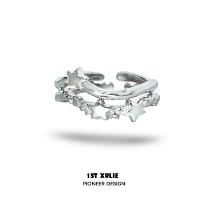 Silver star couple ring featuring a unique intertwined design with star accents