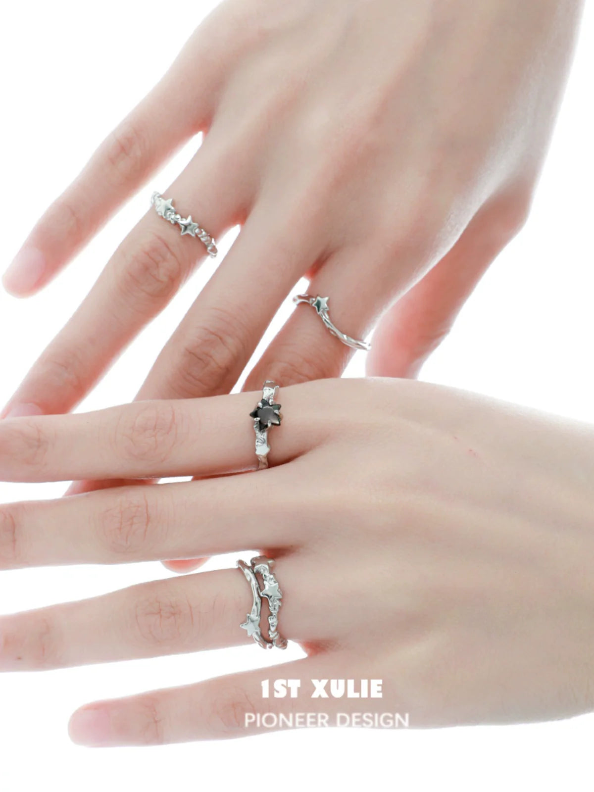 Elegant silver star couple ring set on hands showcasing intricate designs and sparkling stones