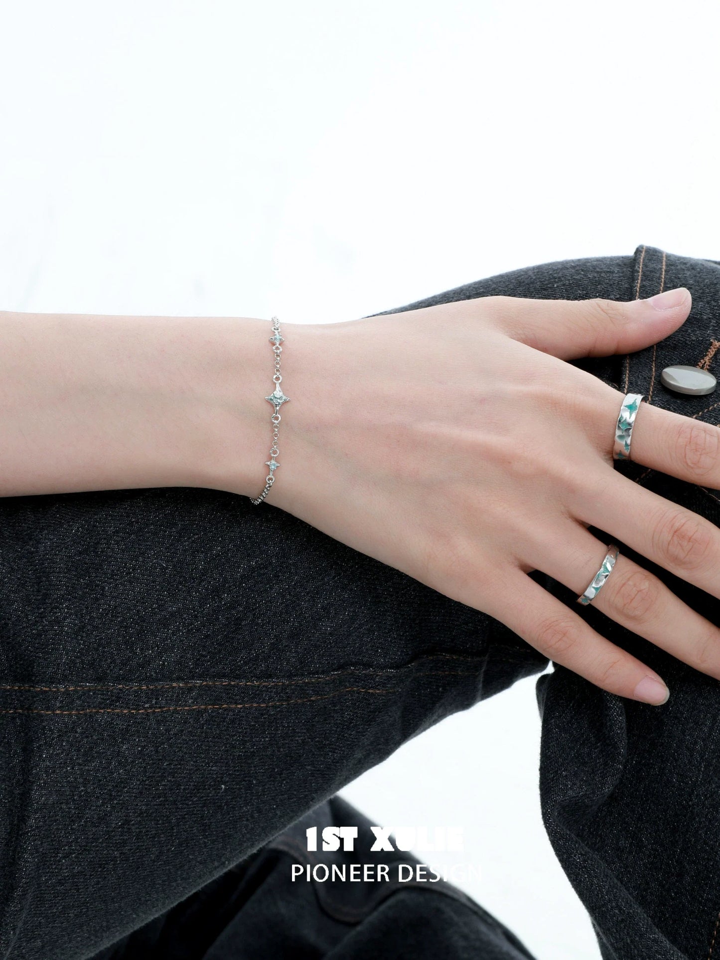 Elegant silver starlight bracelet displayed on a hand, showcasing delicate star-shaped accents