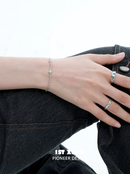 Elegant silver starlight bracelet displayed on a hand, showcasing delicate star-shaped accents