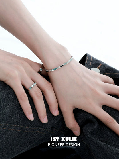 Elegant 1ST XULIE silver starlight bracelet on a wrist, showcasing unique design and modern style