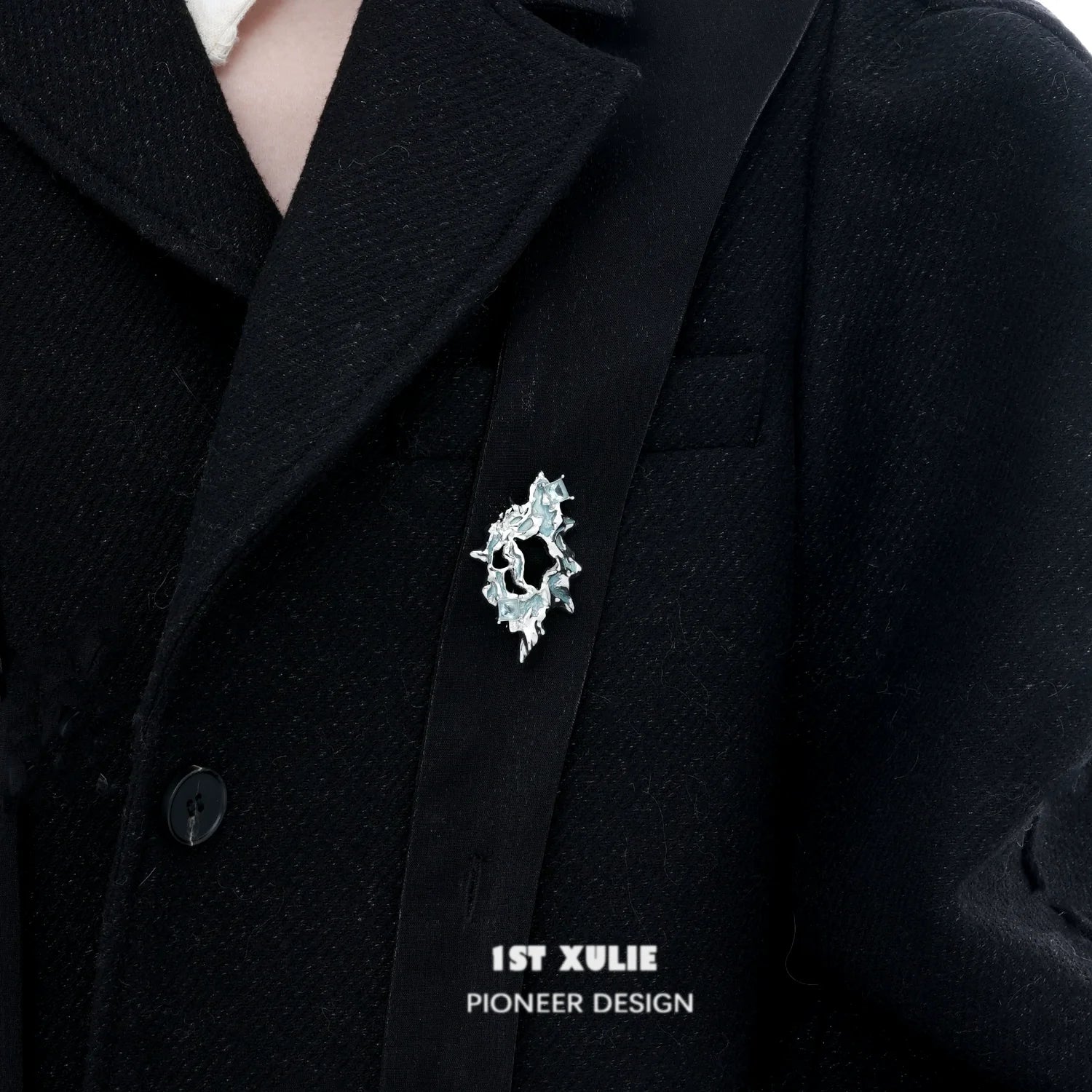 1STXULIE silver statement brooch with unique design worn on a black coat