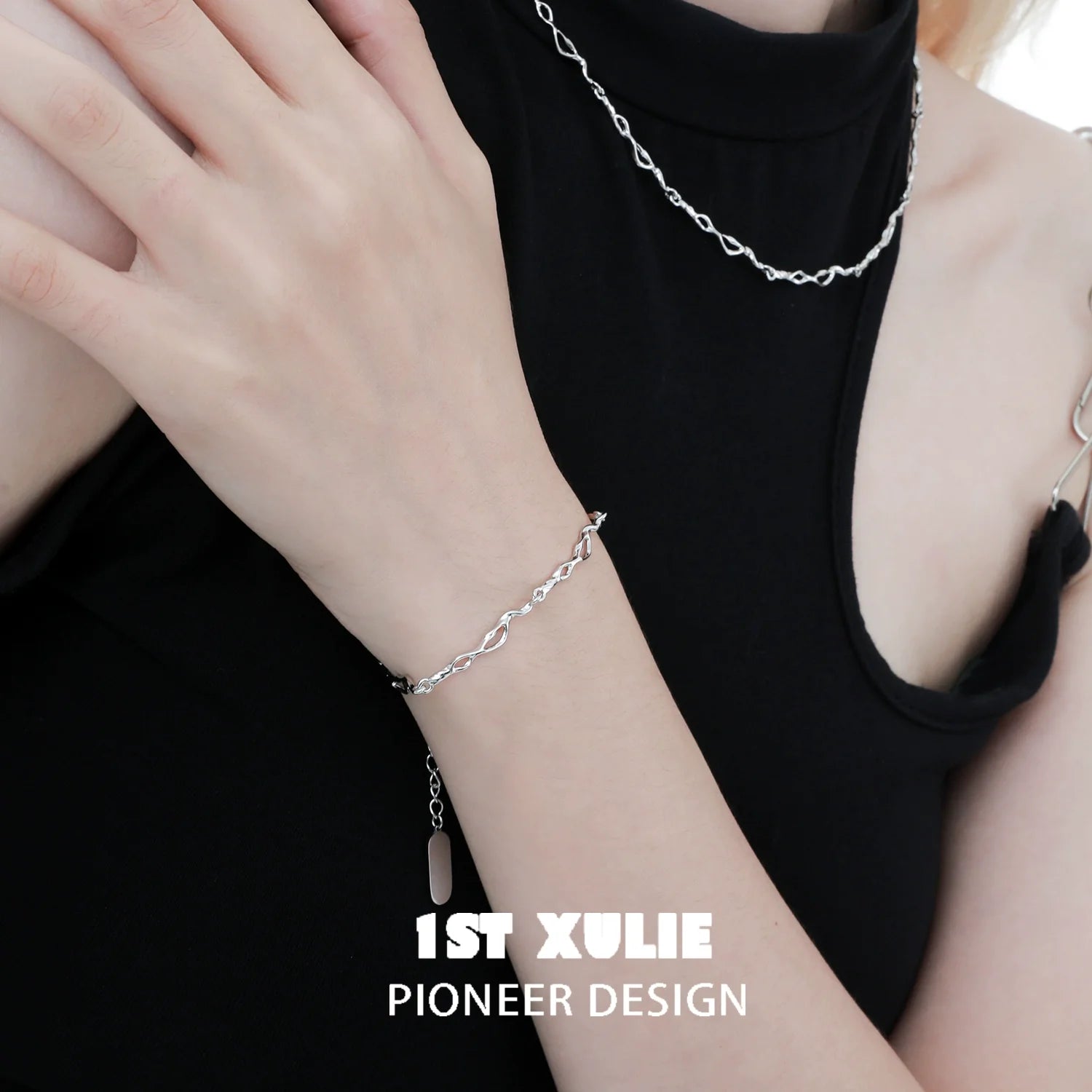 Stylish silver wave chain bracelet worn by a model, showcasing a modern and elegant design