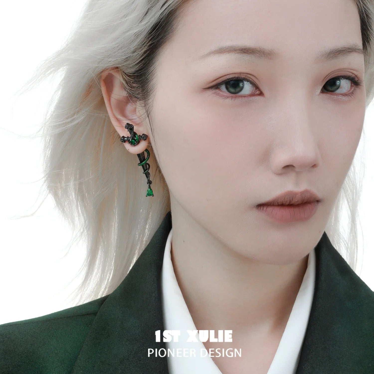 Slytherin inspired cross earrings showcasing green and silver design, perfect for fans of the house.