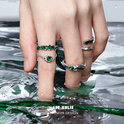 Slytherin inspired green snake ring with intricate design and sparkling green stones on a hand