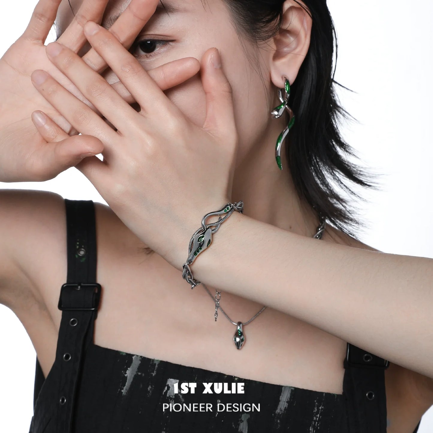 Slytherin snake bracelet featuring intricate design in green and silver, worn on a model's wrist