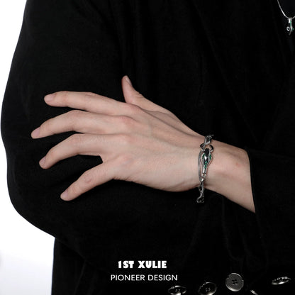 Slytherin snake bracelet in silver with intricate design worn on a person's wrist