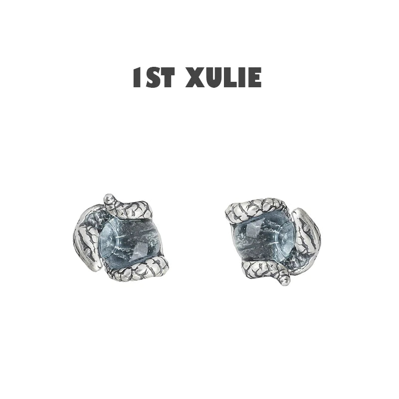 Slytherin snake earrings with detailed silver design and blue gemstone for a unique accessory