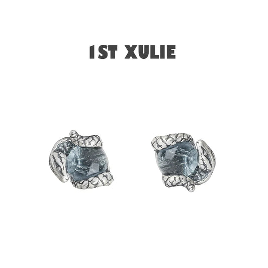 Slytherin snake earrings with detailed silver design and blue gemstone for a unique accessory