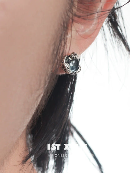 Silver Slytherin snake earrings with green gemstone, perfect for Harry Potter fans