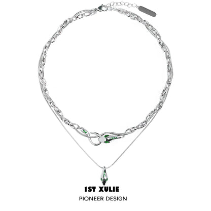 Slytherin snake necklace by 1STXULIE featuring a silver chain and green gemstone accents