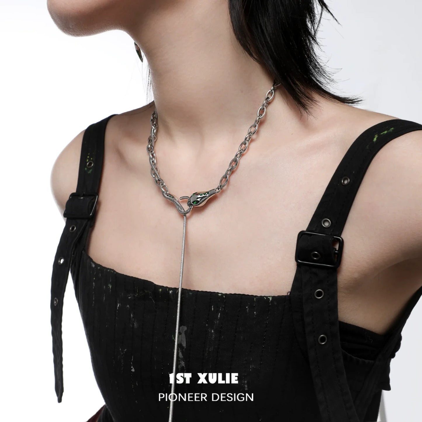 Slytherin snake necklace with a sleek design, worn by a model in a stylish outfit