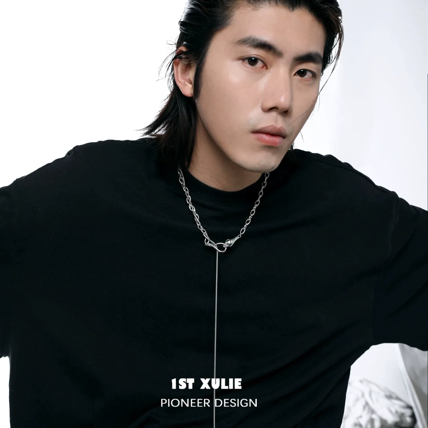 Stylish model wearing 1STXULIE Slytherin snake necklace with a bold chain design